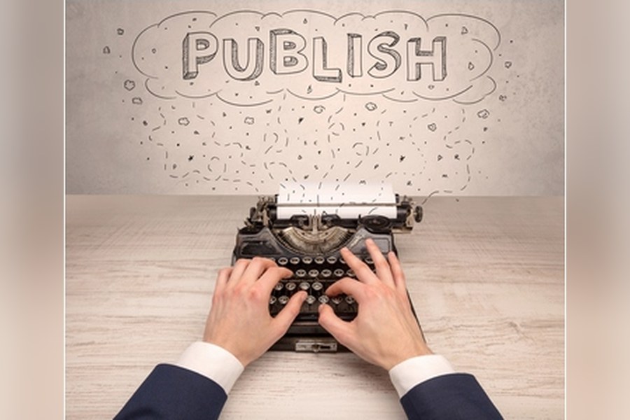 Hands at a typewriter under the word Publish